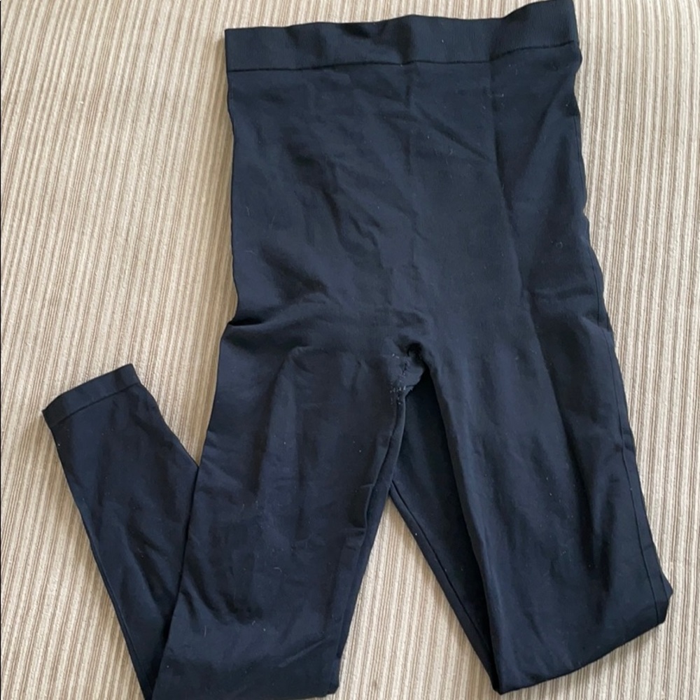 Woman’s black postpartum compression leggings